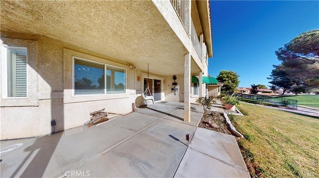 view of patio / terrace featuring fence