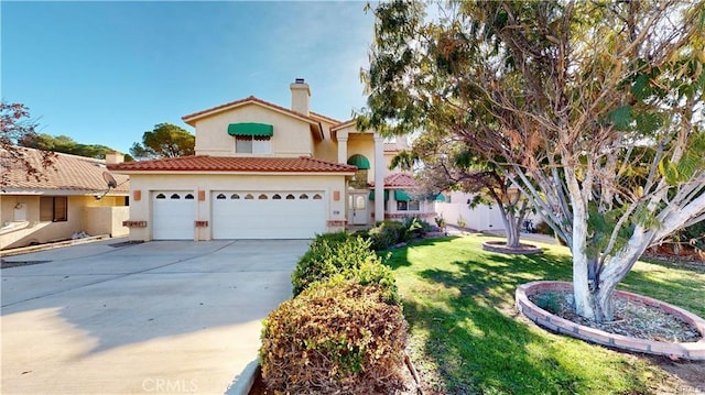 mediterranean / spanish home with a tile roof, driveway, stucco siding, a chimney, and a front yard