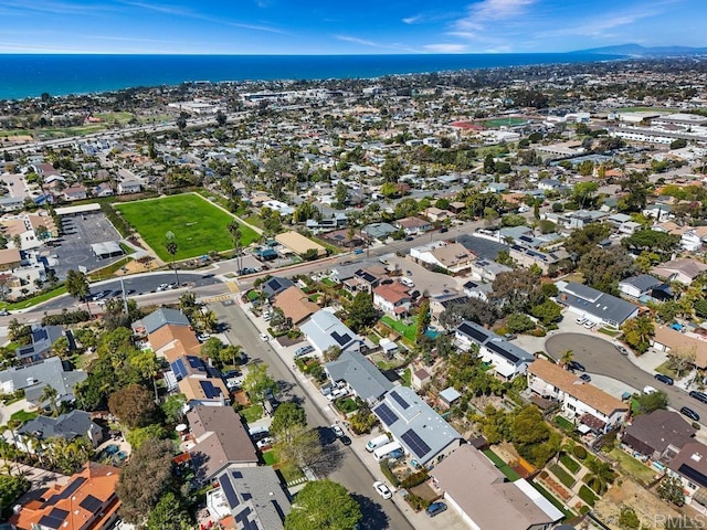 drone / aerial view with a residential view and a water view