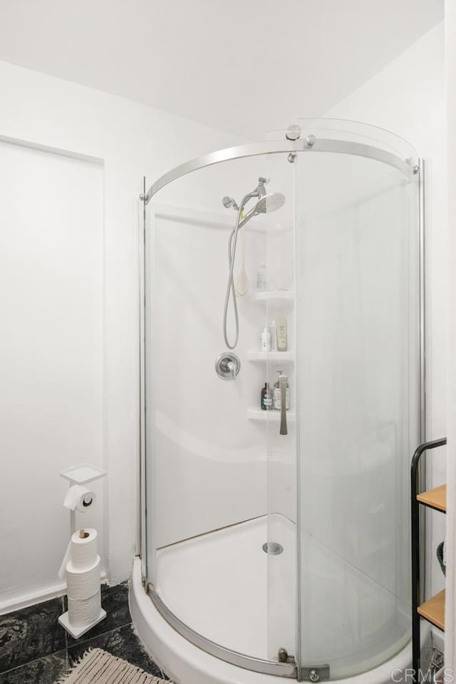 bathroom featuring a stall shower