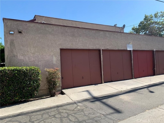 exterior space featuring stucco siding