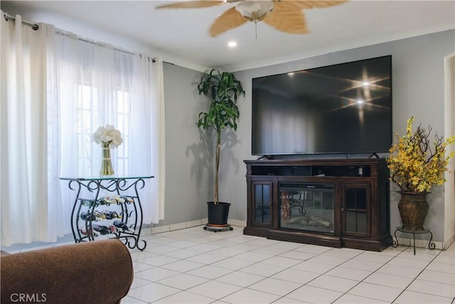 living room with tile patterned floors and a ceiling fan