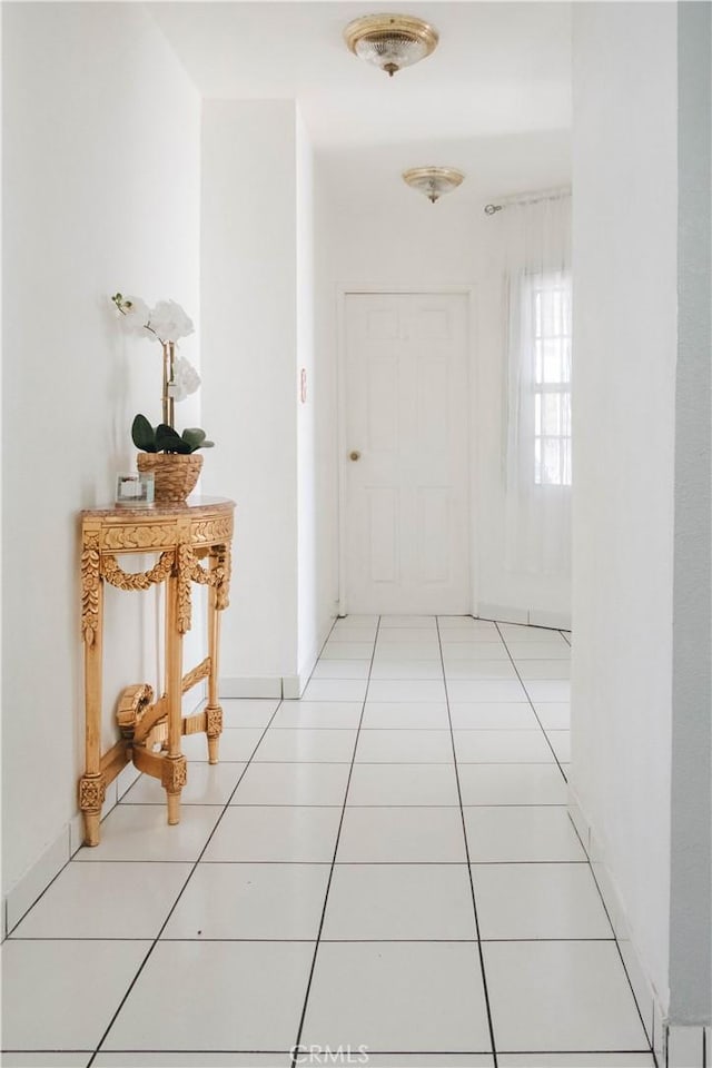 hall featuring tile patterned flooring