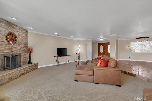 carpeted living area featuring baseboards, a fireplace, and ornamental molding