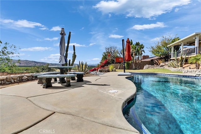 pool featuring a patio area