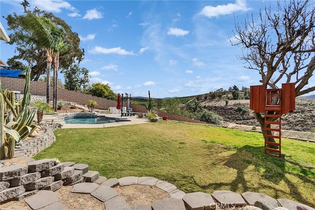 view of yard featuring a fenced in pool, a patio area, and a fenced backyard