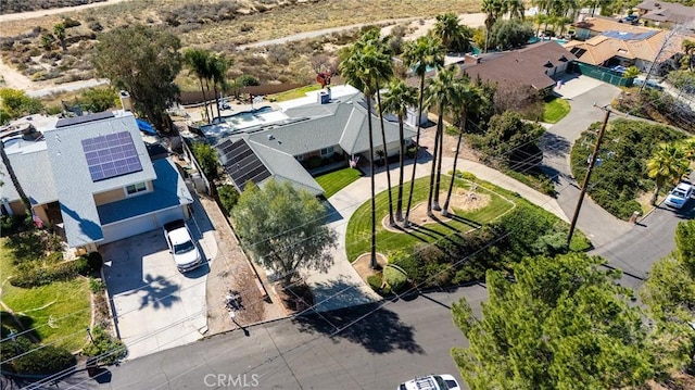 birds eye view of property with a residential view