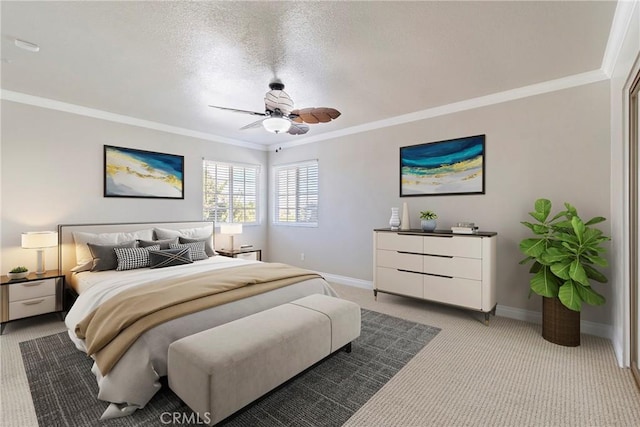 bedroom featuring baseboards, ornamental molding, a textured ceiling, and light colored carpet