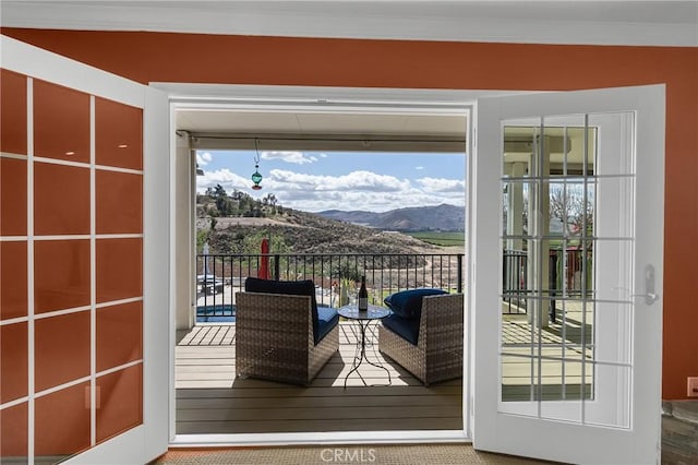 entryway featuring wood-type flooring and a mountain view