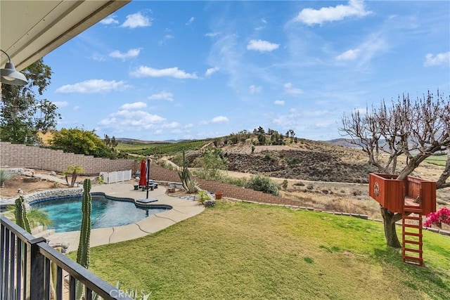 view of swimming pool featuring a lawn, a patio area, a fenced backyard, and a fenced in pool