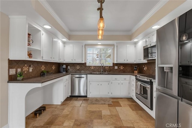 kitchen featuring dark countertops, white cabinetry, stainless steel appliances, and a sink