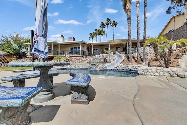 pool featuring a patio area