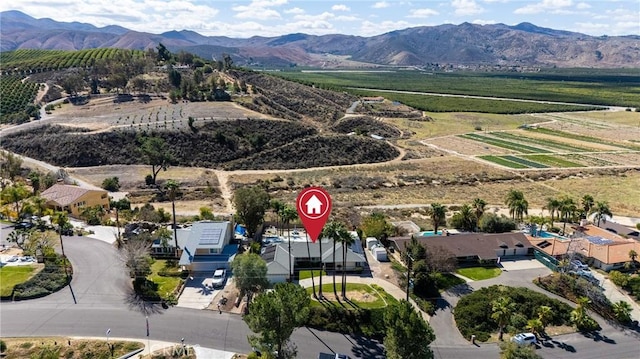 drone / aerial view with a mountain view and a rural view