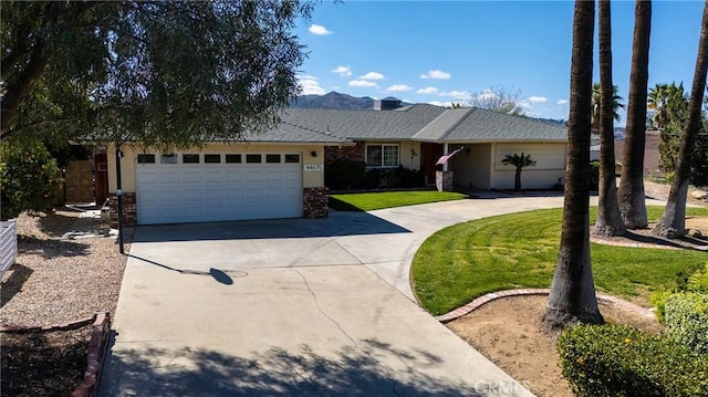 single story home featuring driveway, an attached garage, and a front lawn