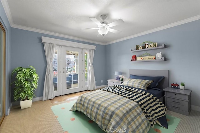 carpeted bedroom featuring access to outside, crown molding, baseboards, and ceiling fan