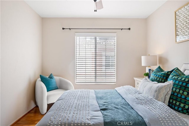 bedroom with wood finished floors and a ceiling fan