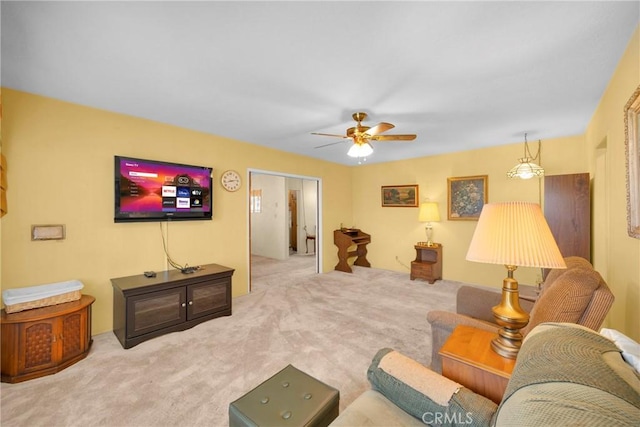 living room with carpet floors and a ceiling fan