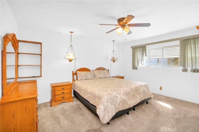 bedroom featuring ceiling fan and light colored carpet