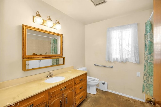 bathroom featuring concrete flooring, toilet, vanity, visible vents, and baseboards