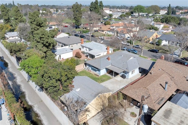 birds eye view of property with a residential view