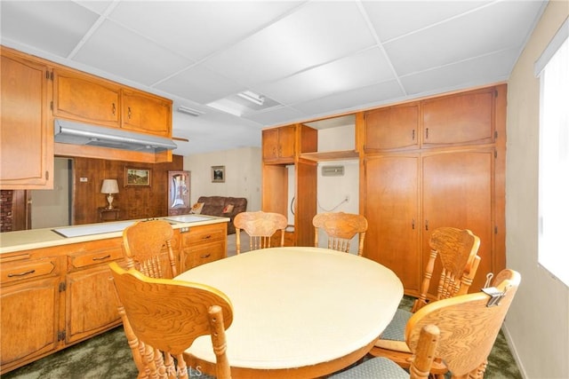 dining area with a drop ceiling