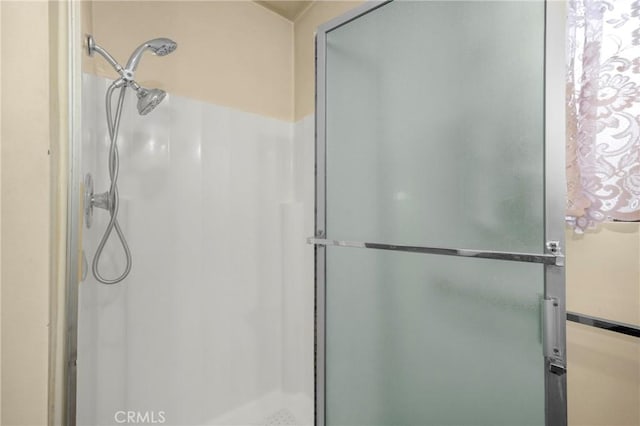 full bath featuring a stall shower