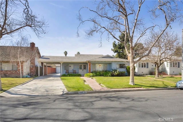 single story home featuring a front lawn, an attached carport, and concrete driveway