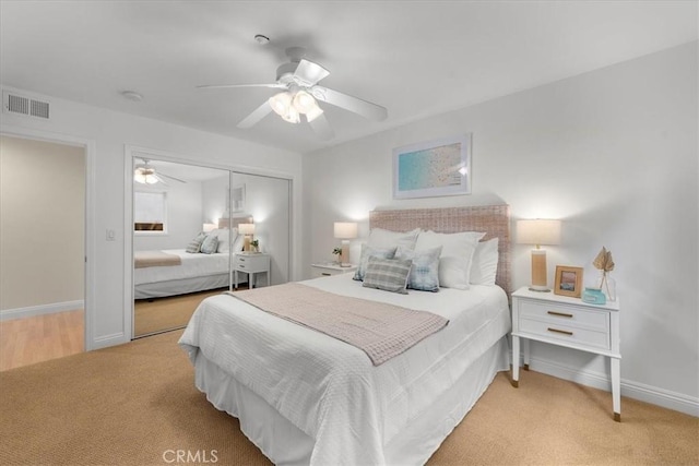 bedroom with baseboards, visible vents, a closet, and carpet floors