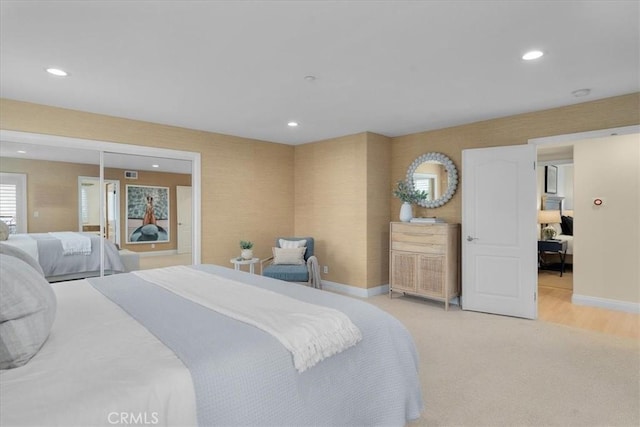 bedroom with recessed lighting, visible vents, baseboards, and light colored carpet