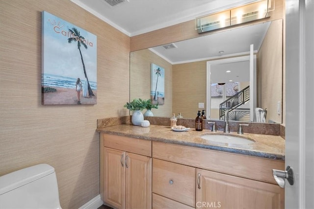 bathroom featuring toilet and vanity