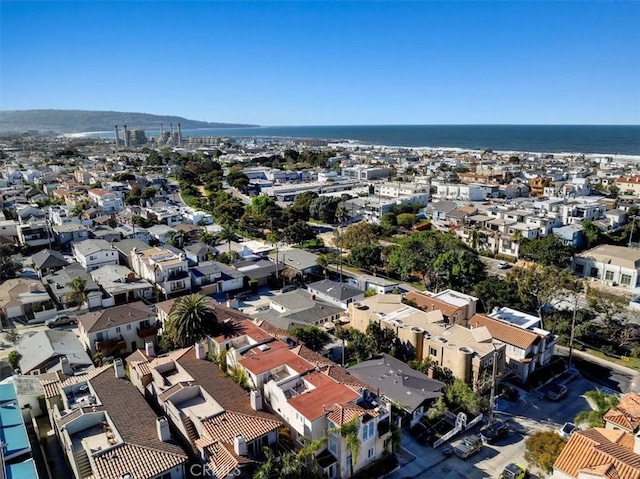 drone / aerial view with a residential view and a water view