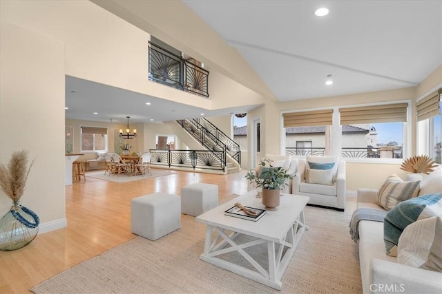living room with baseboards, a chandelier, stairway, recessed lighting, and wood finished floors