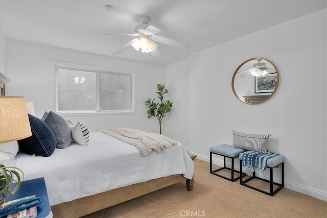 carpeted bedroom featuring ceiling fan and baseboards