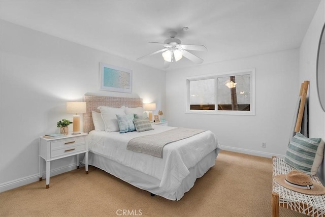 bedroom with light carpet, a ceiling fan, and baseboards