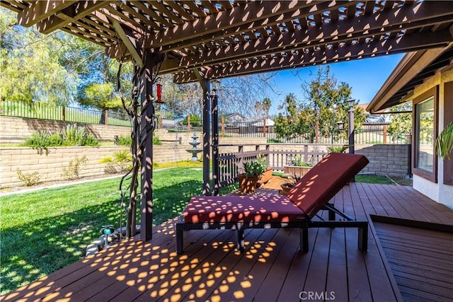 deck featuring a fenced backyard, a pergola, and a yard