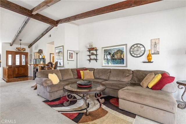 living room with vaulted ceiling with beams and carpet floors