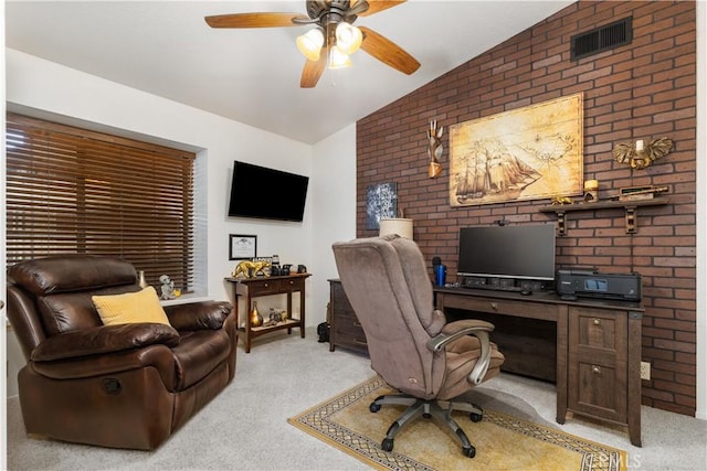 office with vaulted ceiling, ceiling fan, light carpet, and visible vents