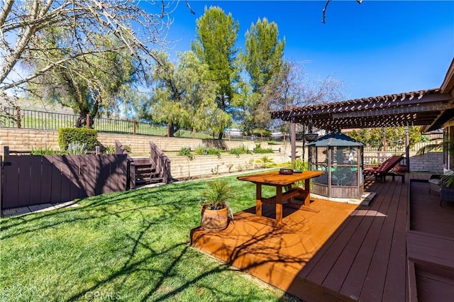 deck with a yard, a fenced backyard, and a pergola