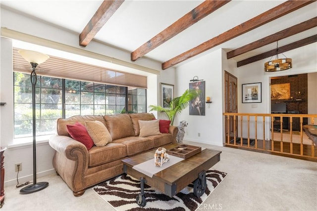 living room with carpet, beam ceiling, and baseboards