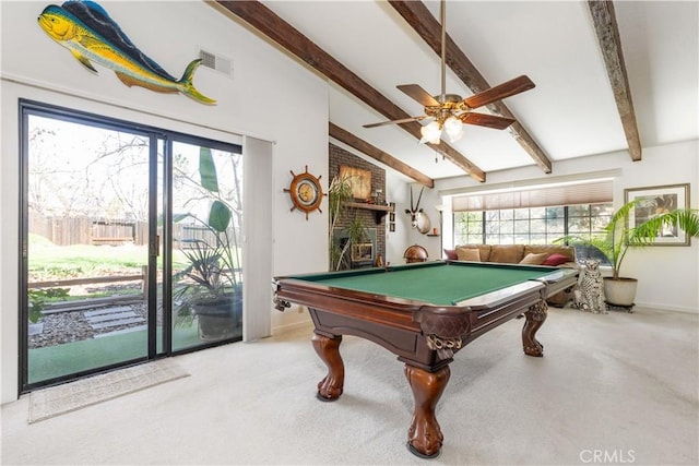 rec room featuring baseboards, visible vents, a ceiling fan, vaulted ceiling with beams, and carpet flooring