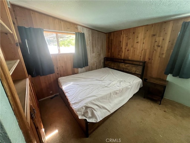 bedroom featuring light carpet, a textured ceiling, lofted ceiling, and wooden walls