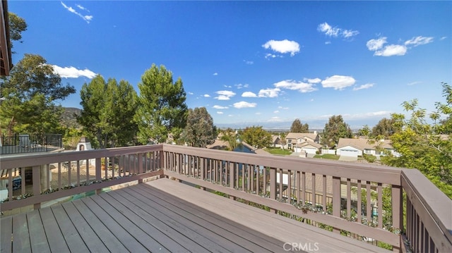 wooden deck featuring a residential view