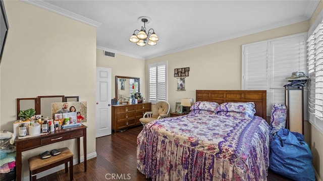 bedroom featuring visible vents, a chandelier, dark wood-type flooring, and ornamental molding