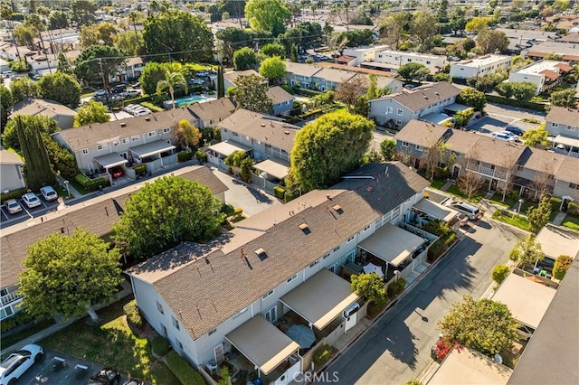 birds eye view of property with a residential view