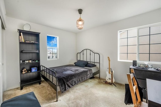 bedroom with carpet and baseboards