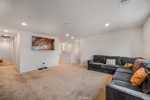 carpeted living area featuring recessed lighting and visible vents