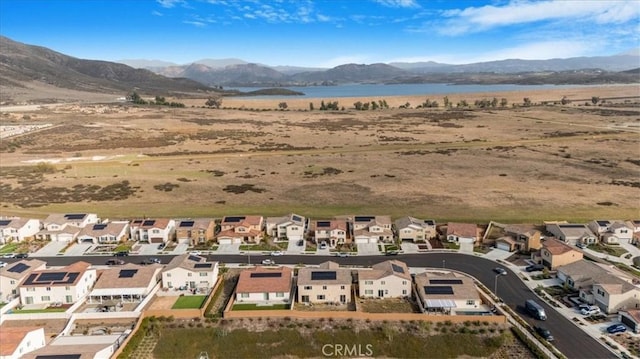 bird's eye view with a residential view and a water and mountain view