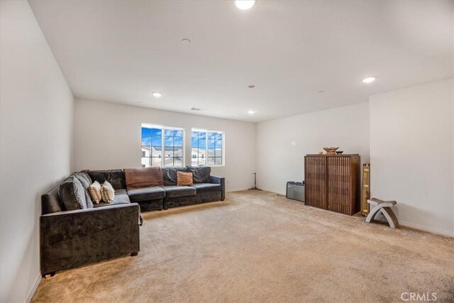 living room with carpet and recessed lighting