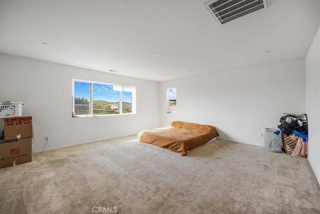 bedroom featuring carpet floors and visible vents