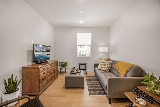 living room featuring light wood-style floors and baseboards